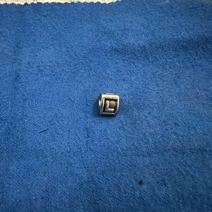 Authentic “L” pandora bracelet charm.